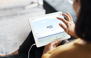 woman using digital banking on a tablet wearing earbuds